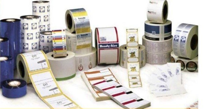 Rolls of self-adhesive labels and thermal transfer ribbons